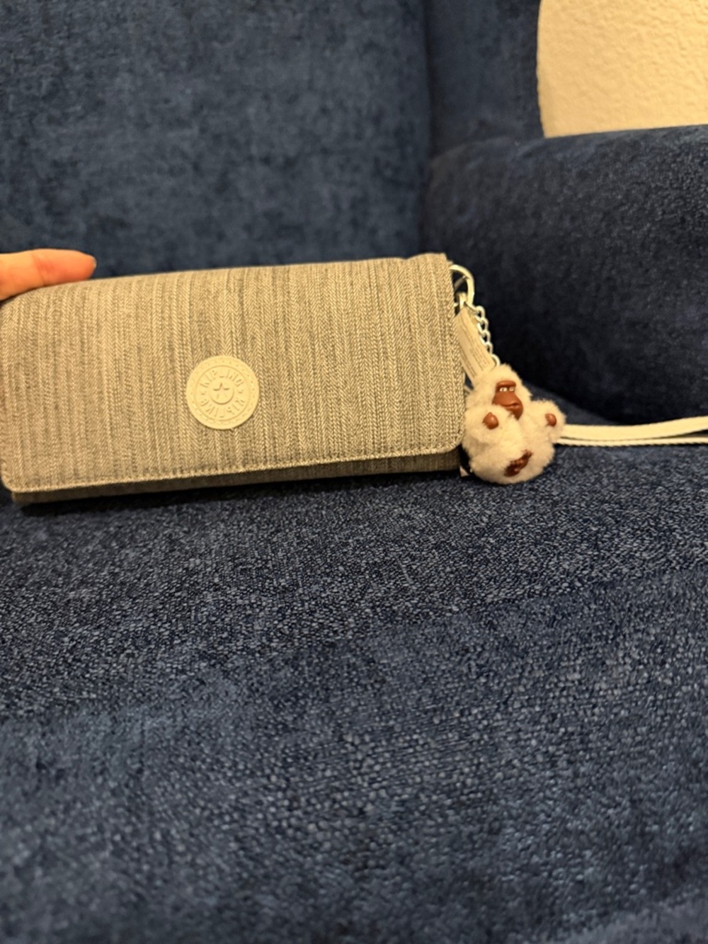 Kipling Light Gray Textured Clutch Wristlet with Pom Keychain